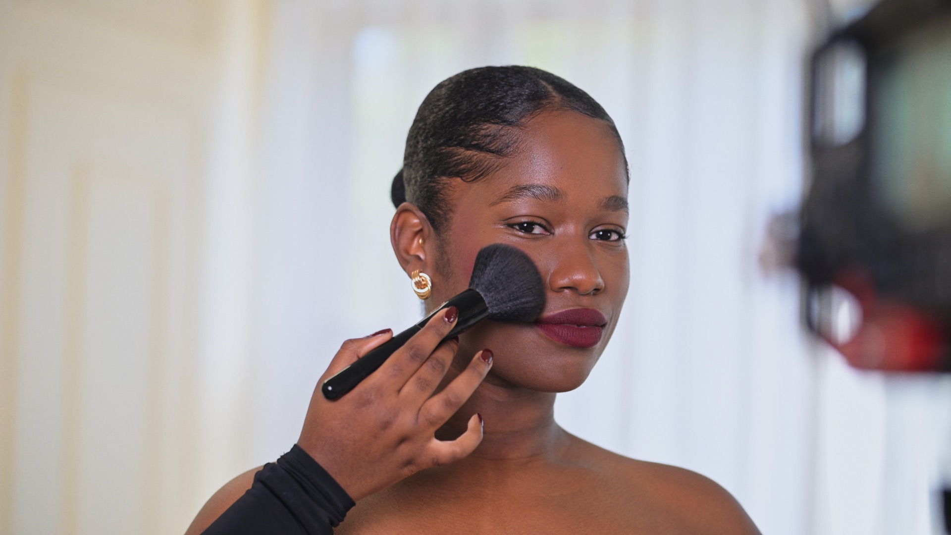 Makeup being applied on a set