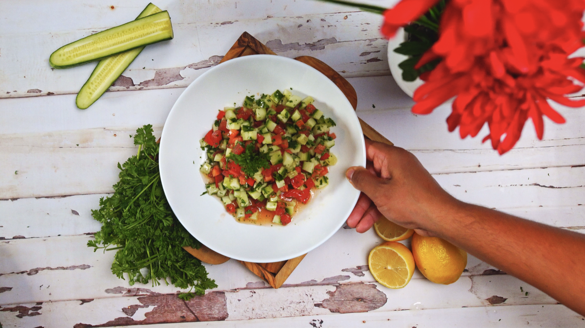 A bowl of cucumber and tomato salad