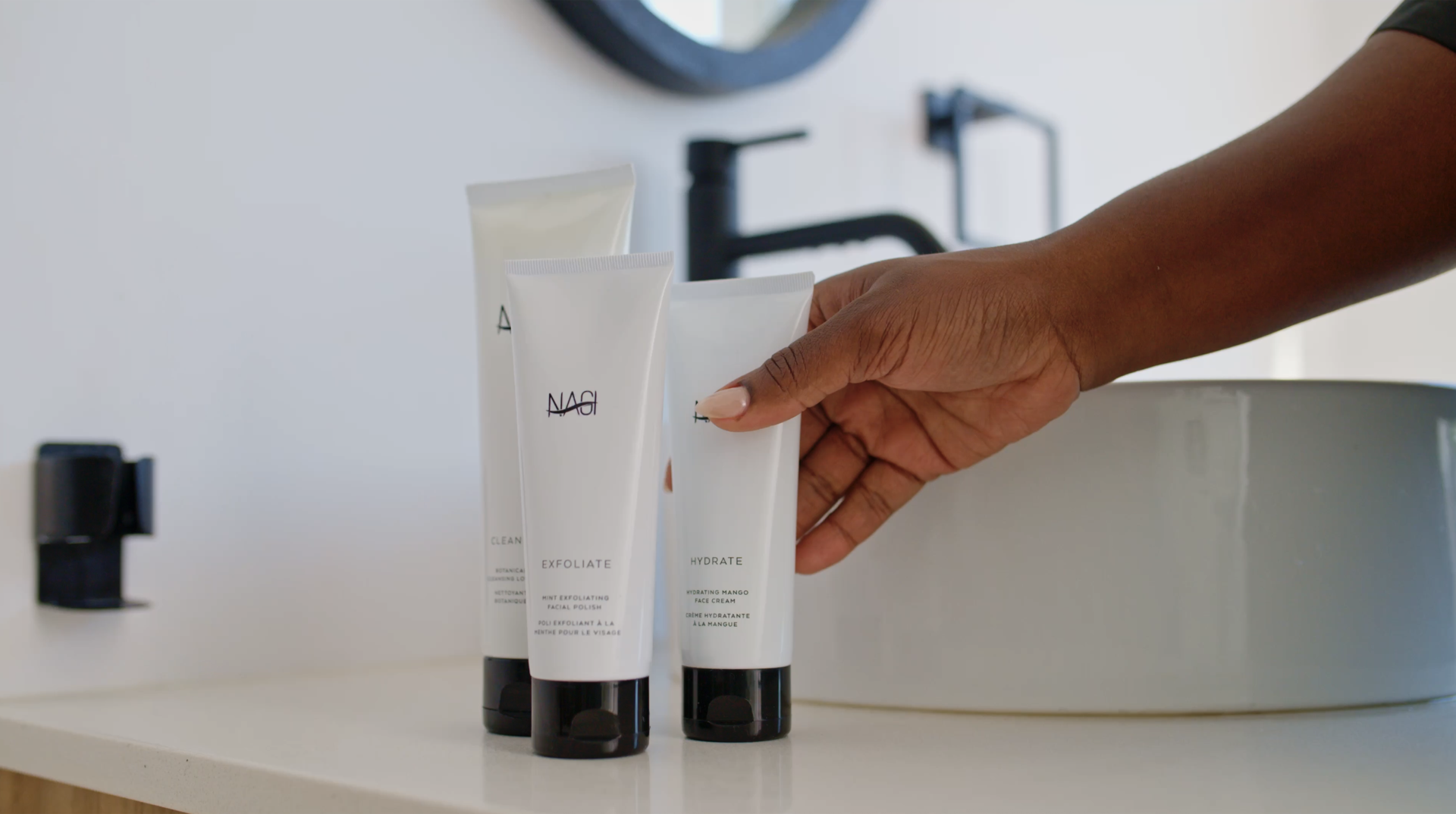 Skincare tubes on a bathroom counter