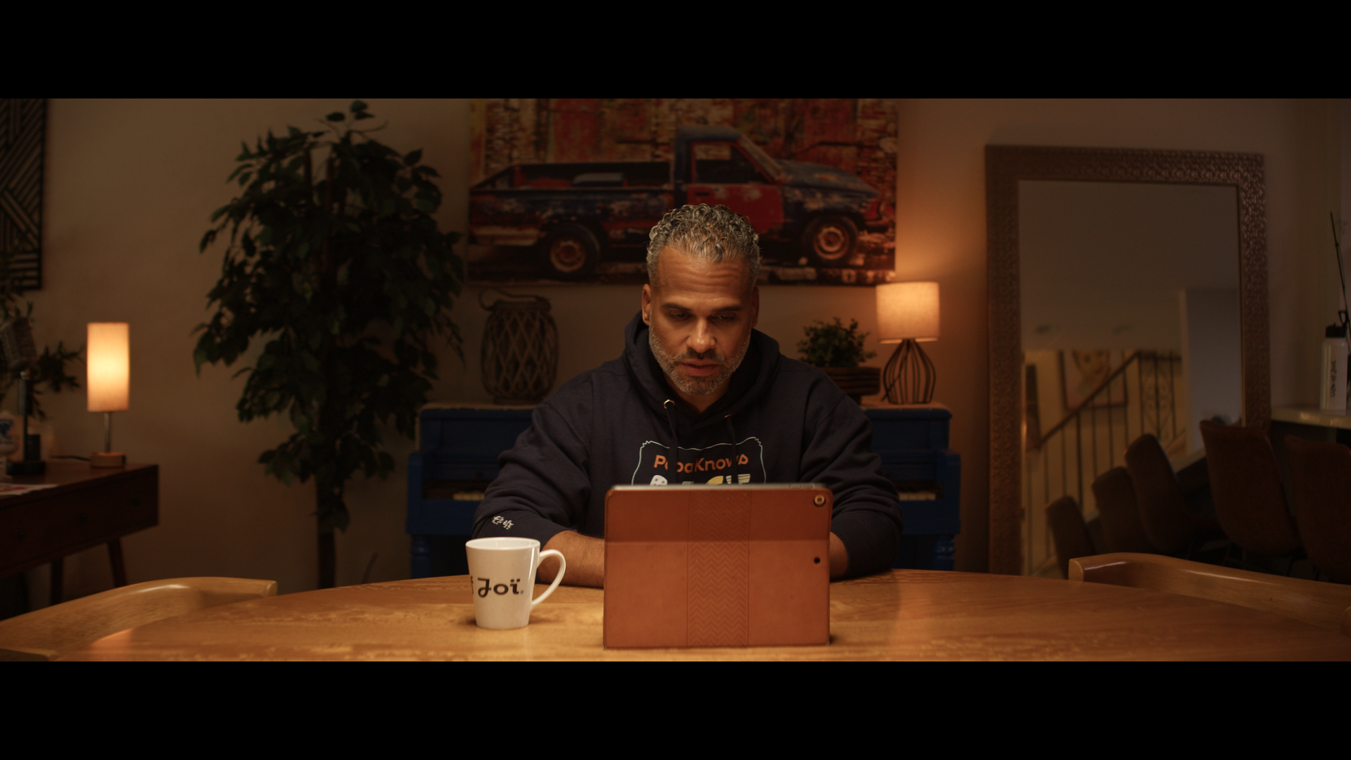 A man looking at a tablet